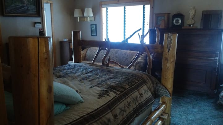 Master room, our largest room with a queen sized bed and couch. Couch can sleep another guest if you desire. This room has its own private entrance with attached bathroom and microwave. We also have an adjacent room with two twin beds available.  