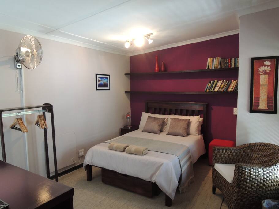 A wall-mounted fan helps in summer while a panel heater keeps the chill out in winter