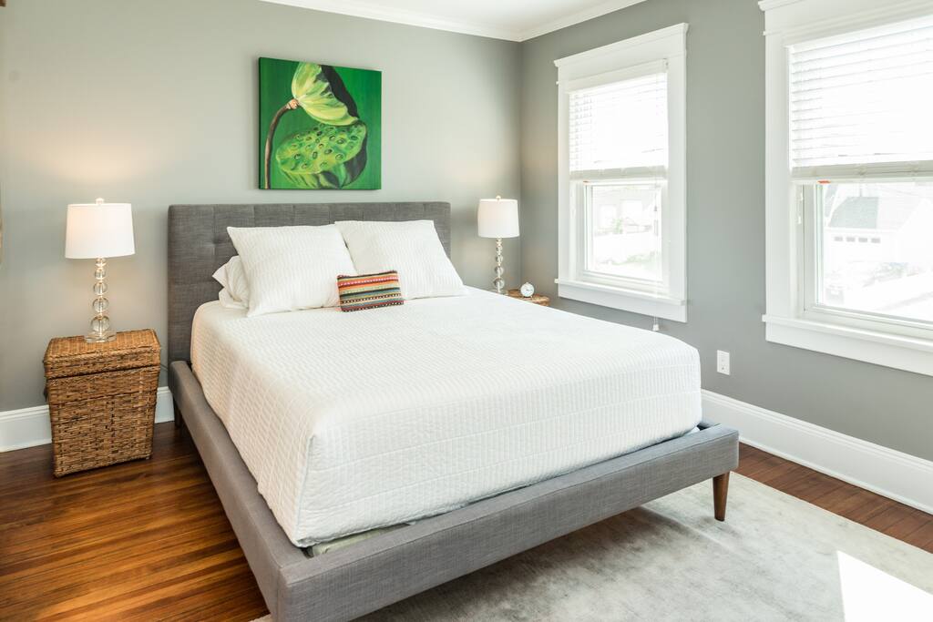 Large sunny upstairs bedroom with queen size bed