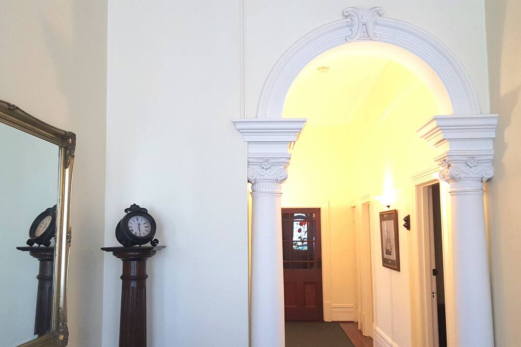Grand entrance with pillars and arch