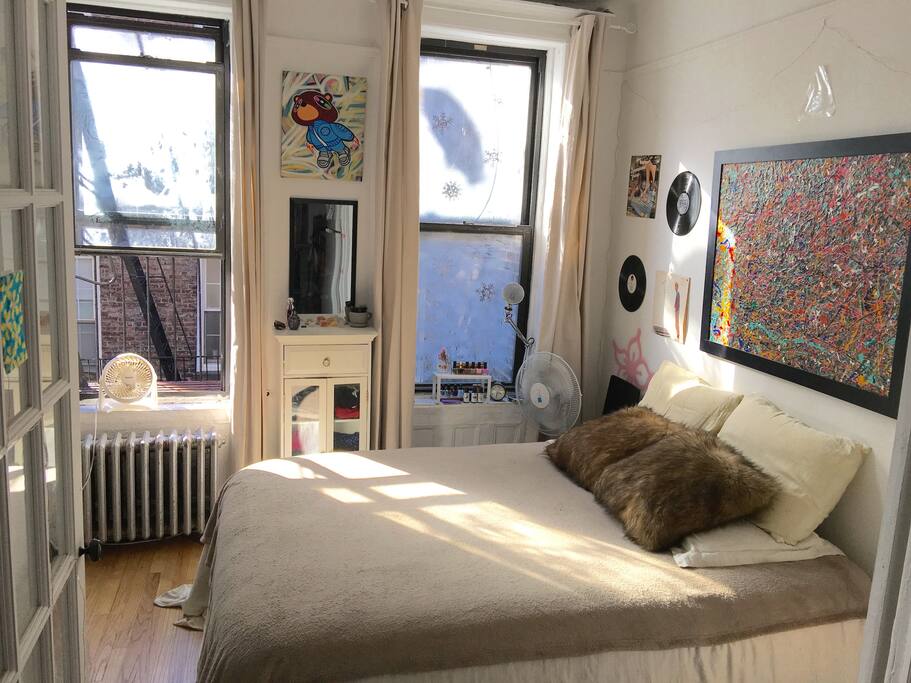 Vast windows facing Sullivan street with fire escape access