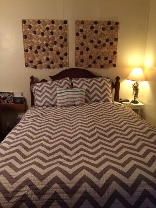 Antique walnut full-sized bed with 300 count, 100% cotton sheets