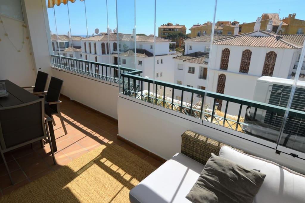 Terrace with glass curtains
