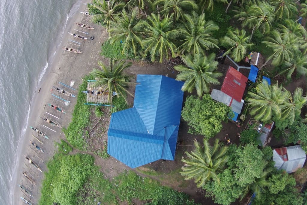 Guests can just stroll down to the shore from Happy Beach House.