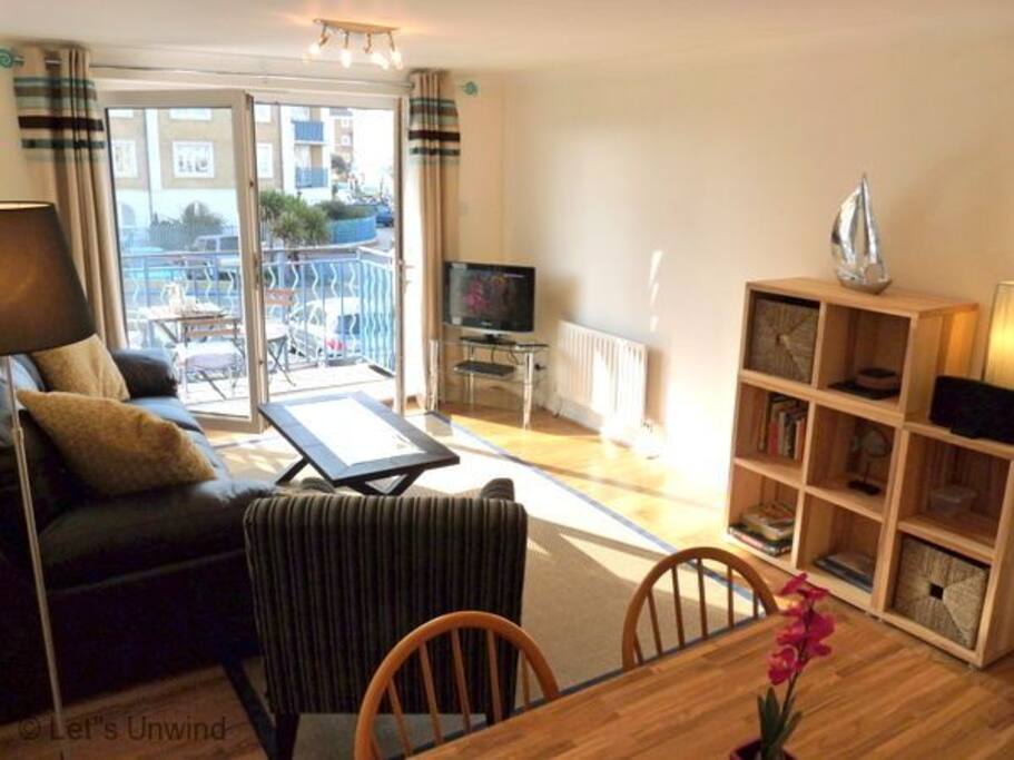 The sunny lounge opens onto the balcony.