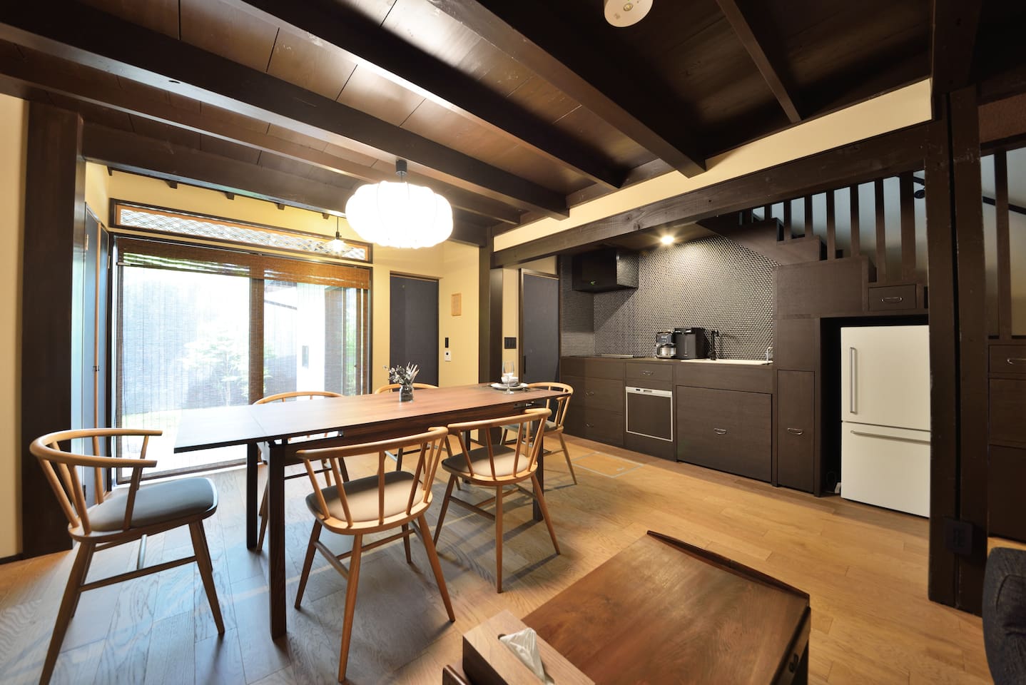 a dining room with a table and chairs