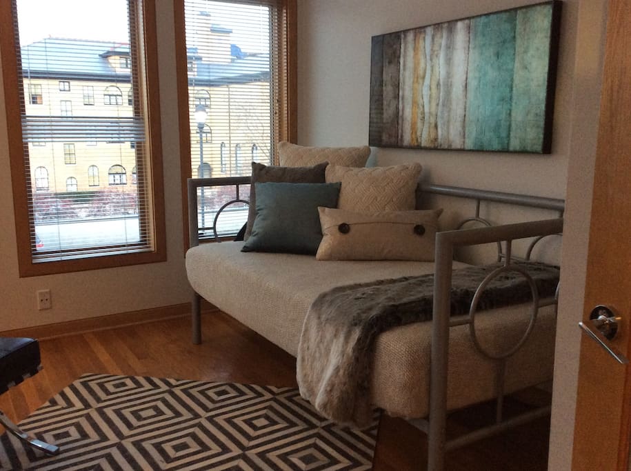 Comfy daybed with new memory foam mattress in the sunroom provides additional sleeping capacity for extra guests