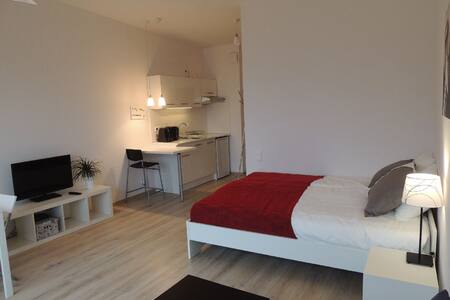 Sunny white studio in Warsaw center