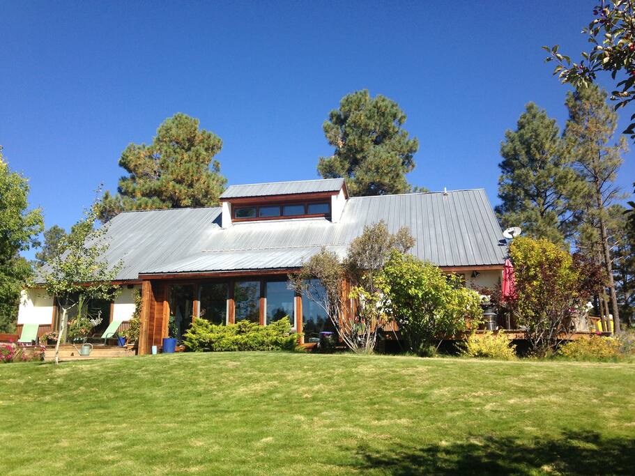 House sits on the lake and is surrounded with lawn, patios and room to roam.