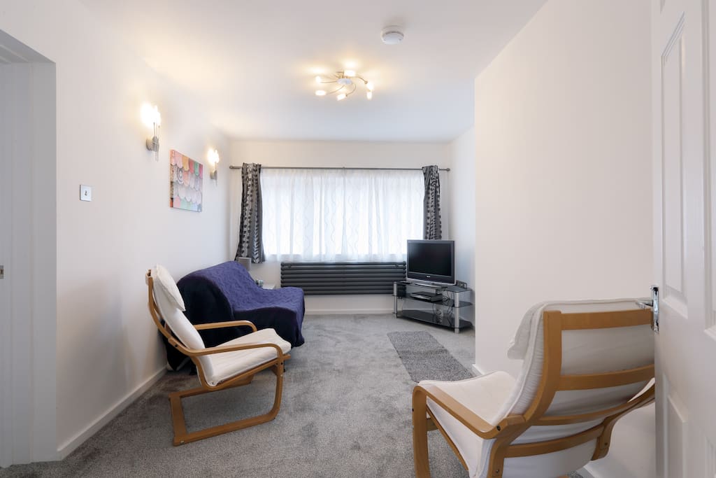 Living room has a futon, TV with freesat box. "accommodation was immaculate. " Gwyn