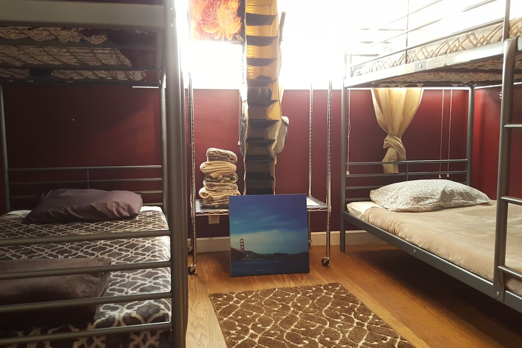 Comfy dorm style bunk room with brand new beds, mattresses, bedding, wifi, cable TV and more!