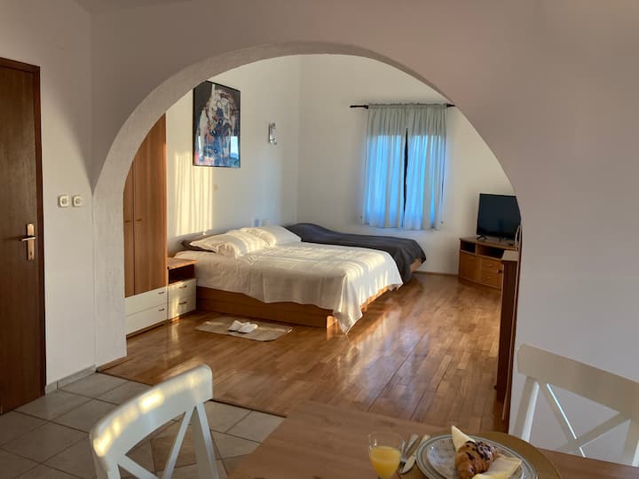 The living / sleeping area is divided from the dining area by a typical arch, so common in the Mediterranean architecture.