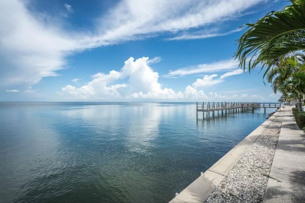 Fishing pier is about 50 feet to the right of the living room patio.