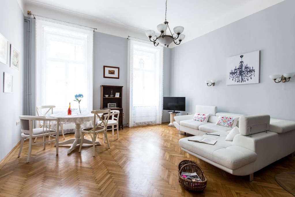 Big living room with authentic features and antique chairs. The sofa is convertible and can sleep 2 people.
