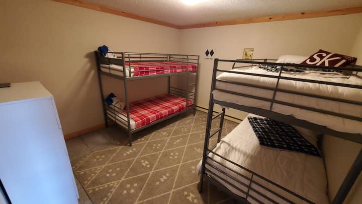 2 twin over twin bunk beds in downstairs bedroom