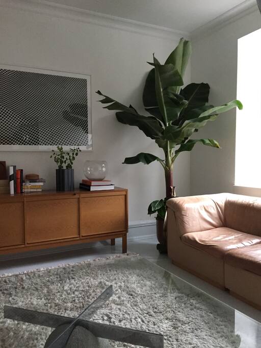 Another view of the living room with the large comfortable vintage leather sofa