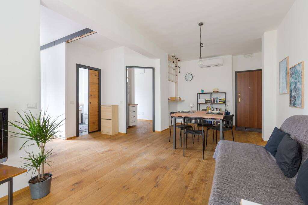 The living room: the dining table & the sofa bed x2