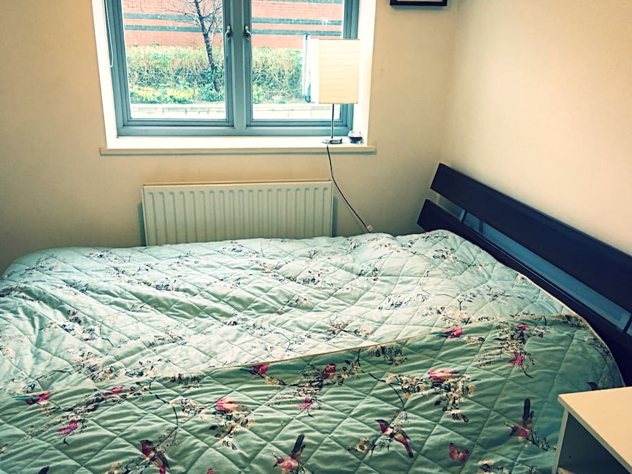 This is the first of two bedroom, each containing a king-sized double bed and looking out over a tranquil communal garden area. The second bedroom also contains an en-suite shower room.