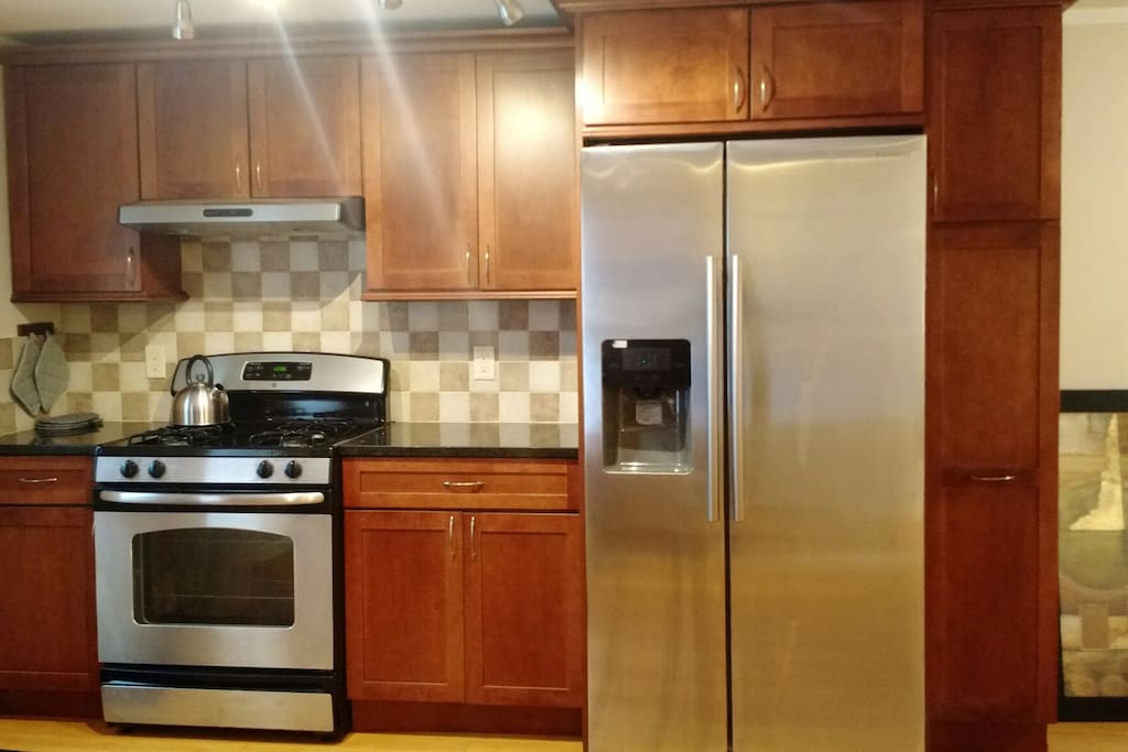 New stainless steel appliances in a welcoming kitchen make cooking a breeze