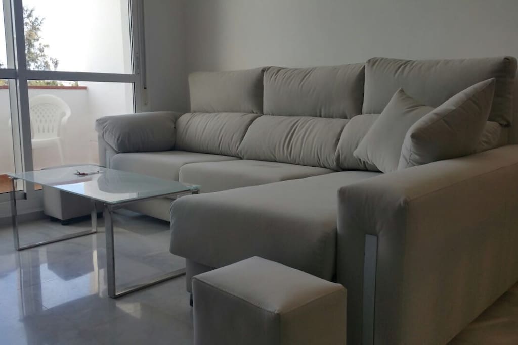 Huge comfortable sofa with foot rest.