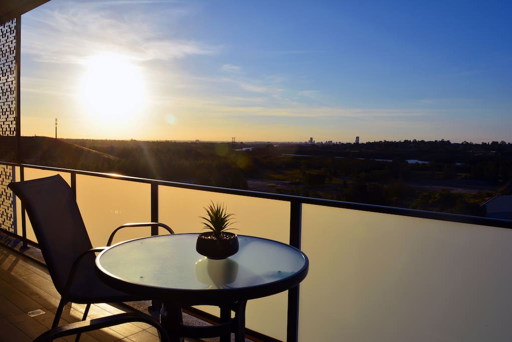 Our balcony features a bar table and chairs overlooking the horizon