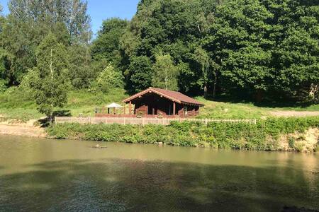 Traditional Log Cabin On The Lake