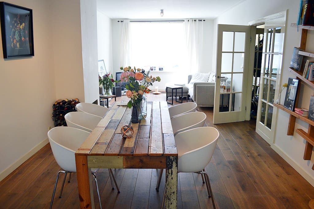 Enjoy a great dinner at this lovely dinner table and living area in the back