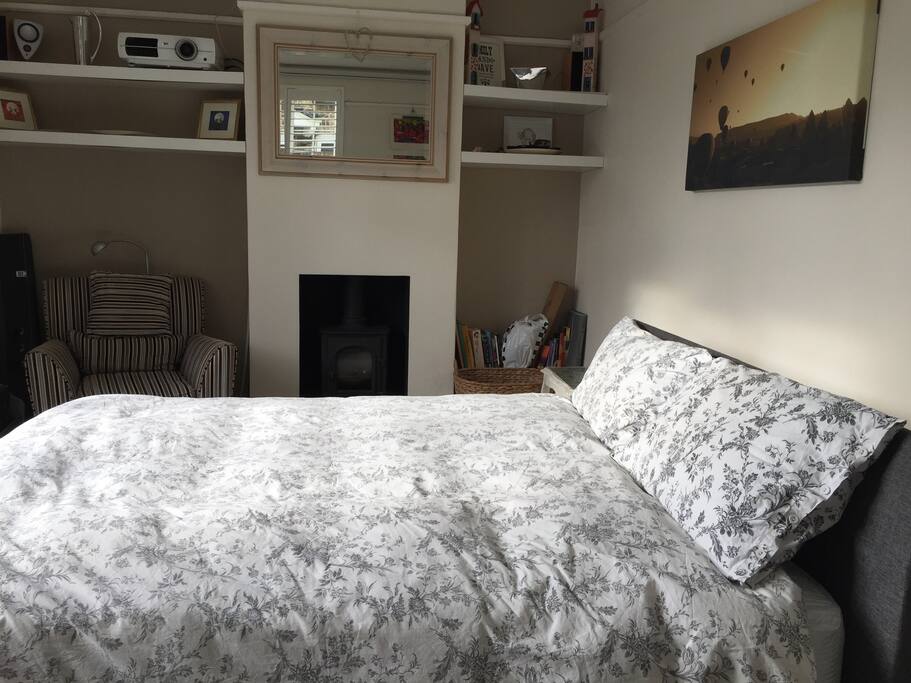 King size bed, wood burning stove, morning sun