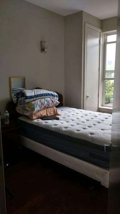 upstairs bedroom (window and small rooftop access)