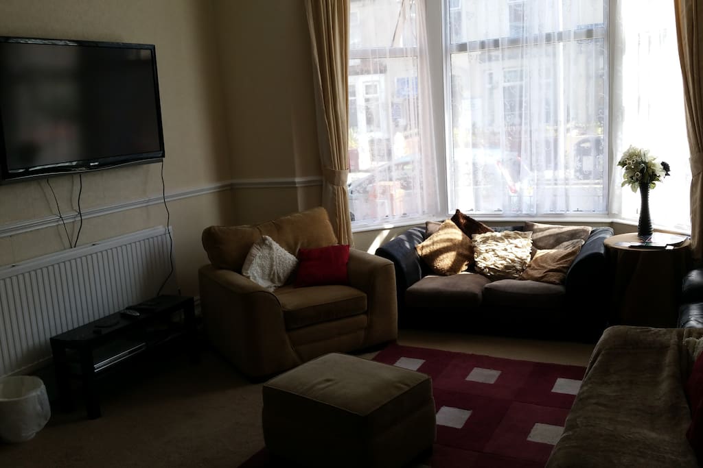 lovely big guest lounge with lots of big settees to relax on