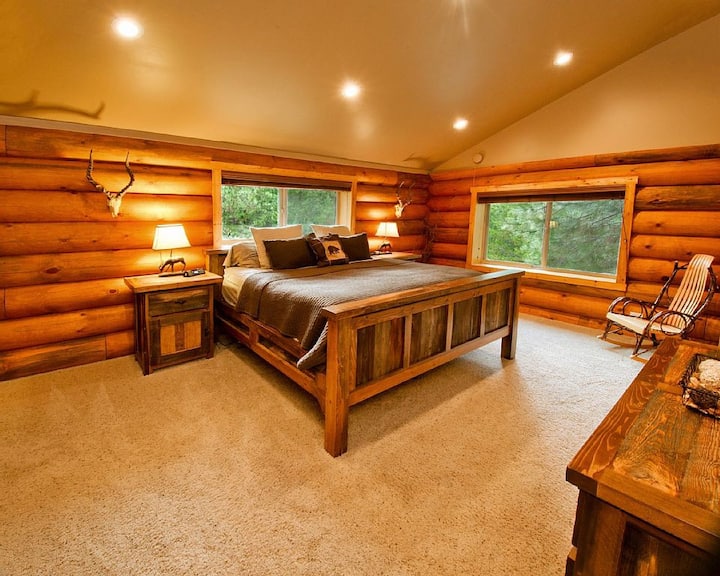Master bedroom boasting a King-size 150-year-old reclaimed Wyoming Barnwood bed.