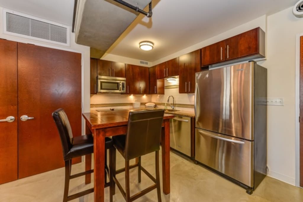 New cabinetry, granite counter tops, and stainless steel appliances