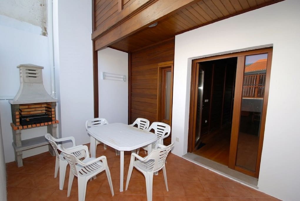 Terrace with dining table and BBQ
