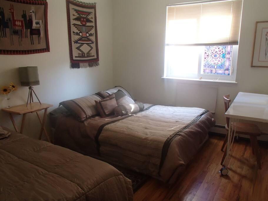 Guests' room with 2 beds: 1 Queen-size, 1 Twin-size. Computer desk and chair. Fee WiFi connection.