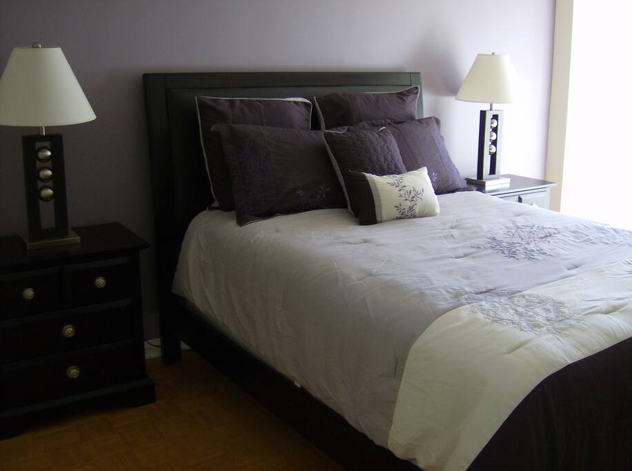 Second bedroom with queen size bed and quality bedding