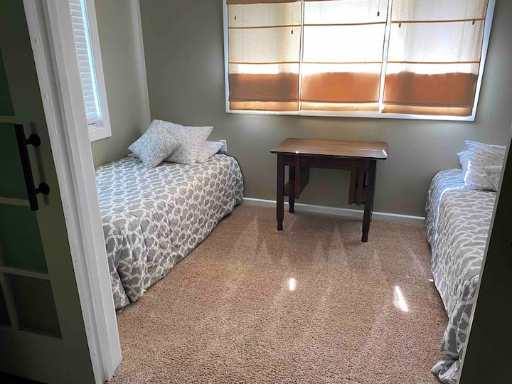 Located just off the living room, this bedroom includes 2 twin beds perfect for kids and singles!