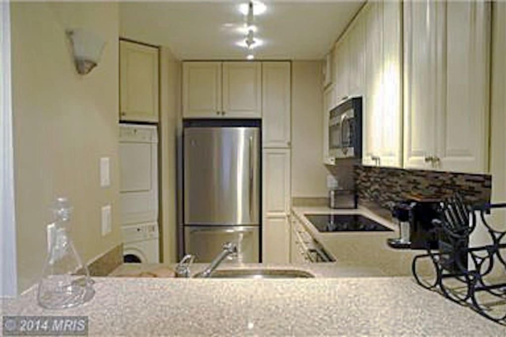 Kitchen with stainless steel appliances & quartz counter tops