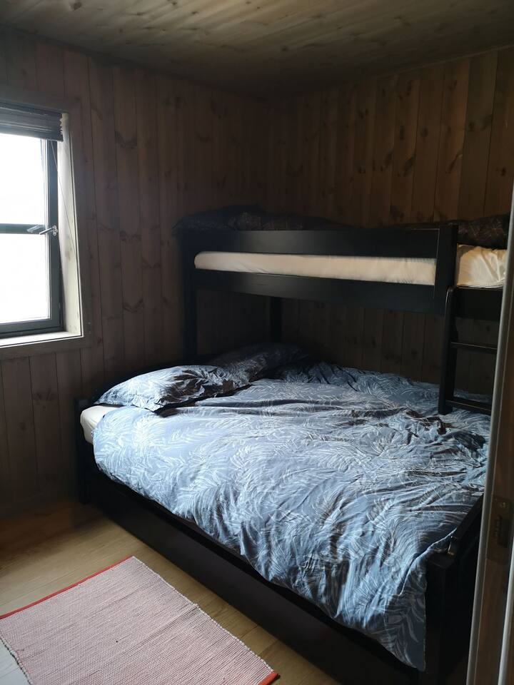 3 of the bedrooms have a trundle bed with 120 bed downstairs and a single bed above. Last bedroom has a 180 bed and the possibility of a cot 