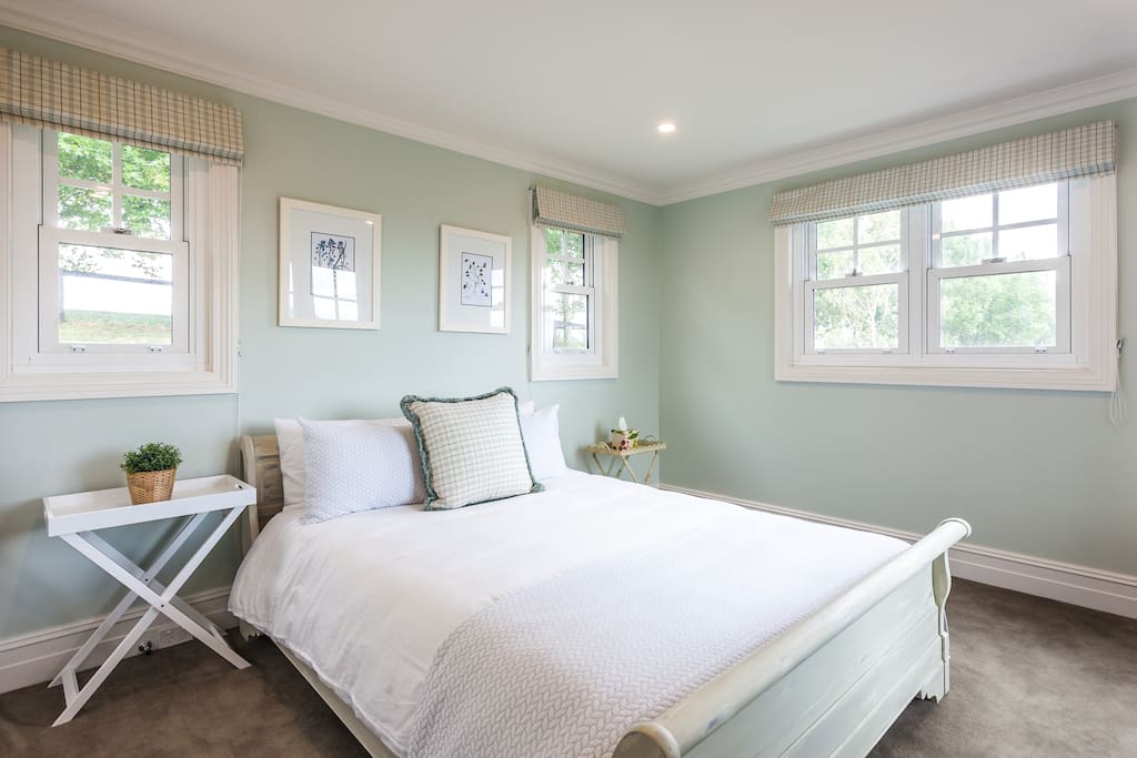 Bedroom one - Queen size bed with views from every window
