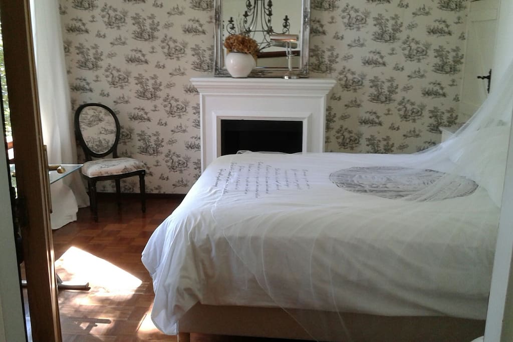 Bedroom 1 (a) with double bed and garden view of 100 year old Weeping Willow tree