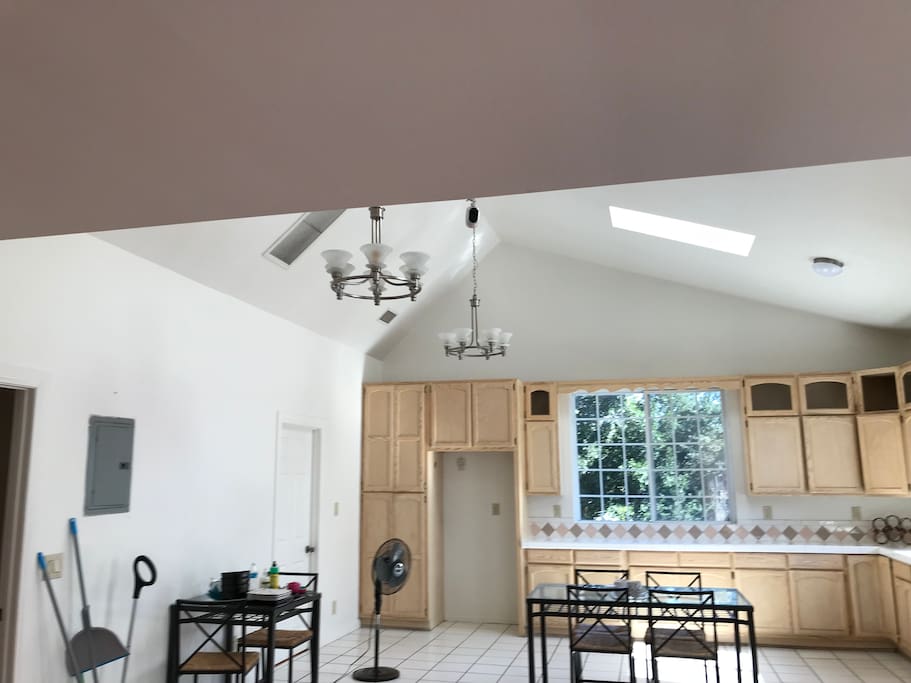High ceilings, skylights, and plenty of natural lighting enhance the openness of this "great" room.