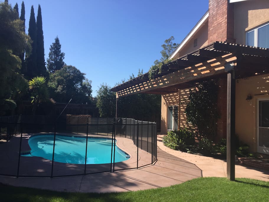 The pool is fully enclosed with child safety fencing.