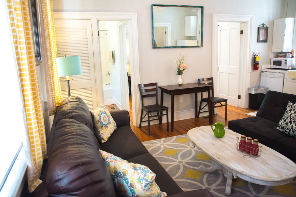 living room with smalling dining table that expands