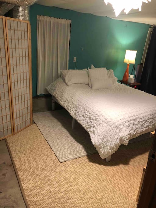 New Queen bed with modern layout.
Shoji screen covers the furnace.