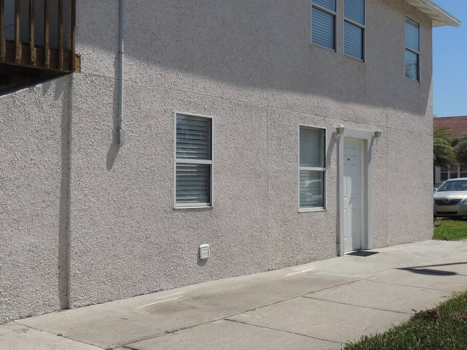Exterior of Triplex and Front Door of Cozy Beachside Studio
