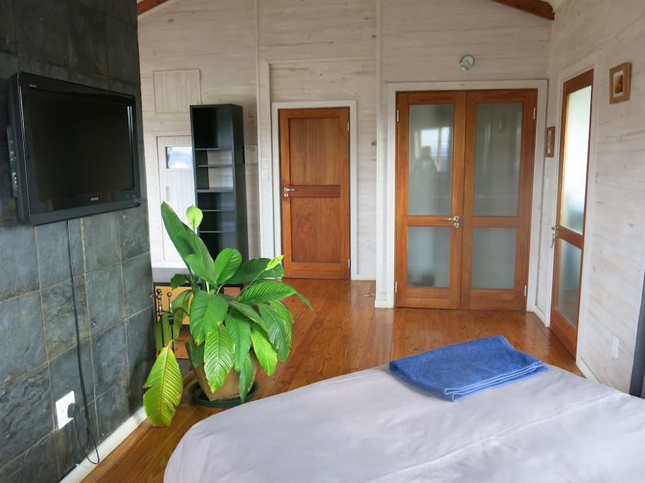 Looking from bed to walk in cupboard and sauna