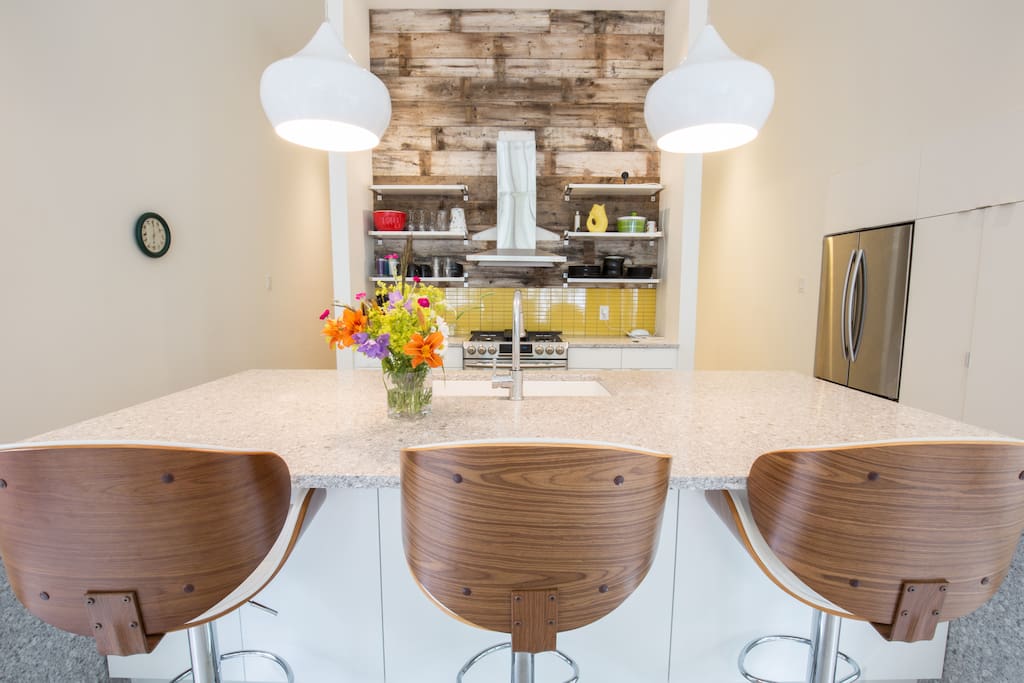 Kitchen island and stove! Dish washer is on the other side of he island.