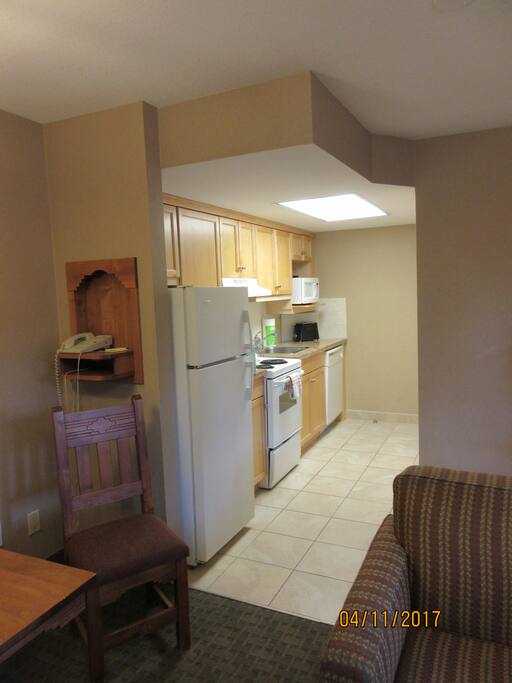 Full kitchen with dishwasher.