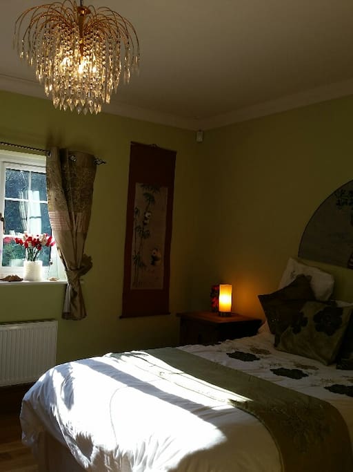 Sunny tranquil Queen-size bedroom with Solid Oak floors