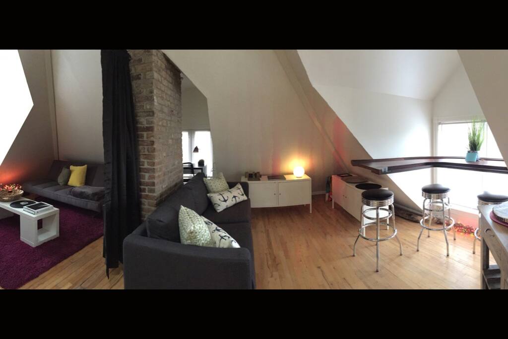 X-Large Living room area. Tv room/sleeper sofa on left, kitchenette-Lounge area on right.